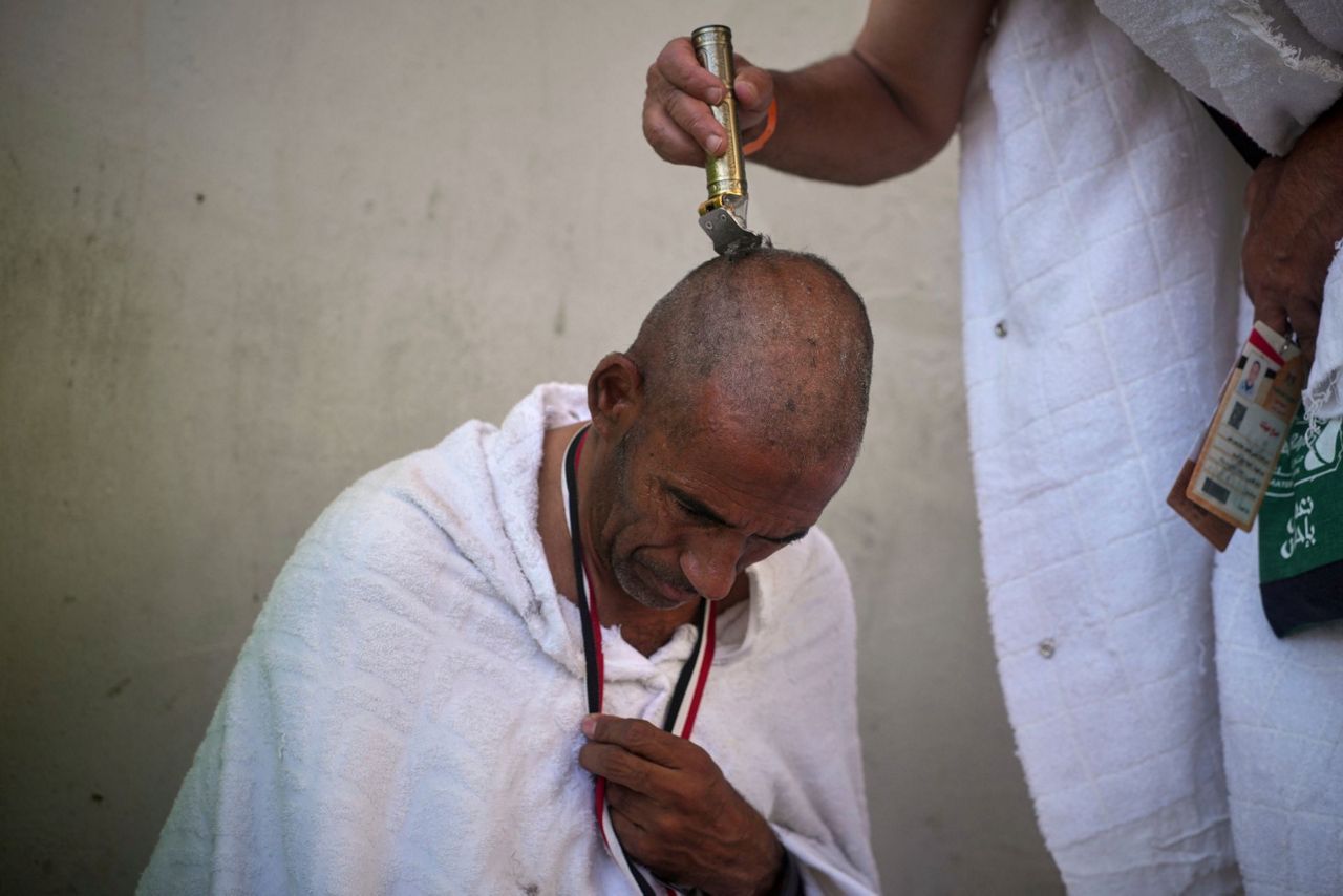 Symbolism and smiles during the stoning of the devil ritual at the Hajj