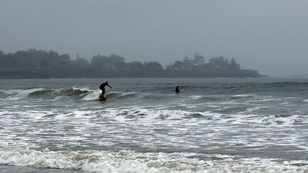 Nor’easter waves bring surfers to Higgins Beach