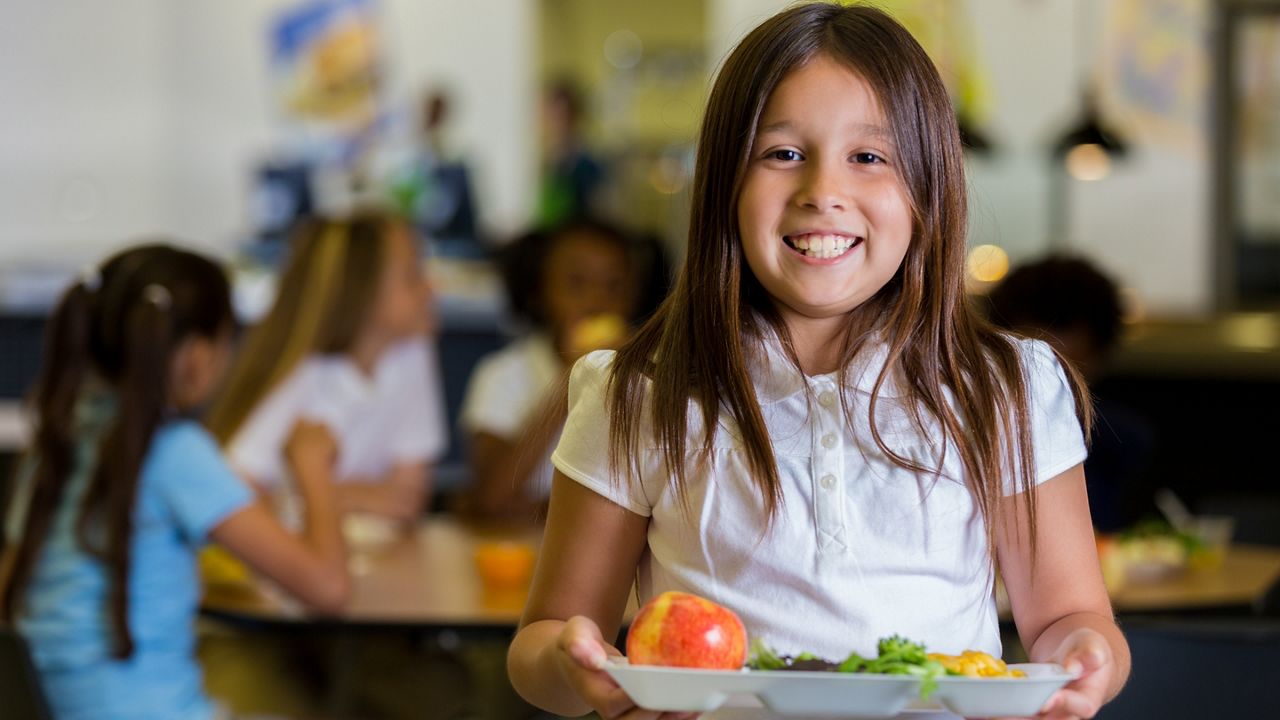 Girl with lunch tray