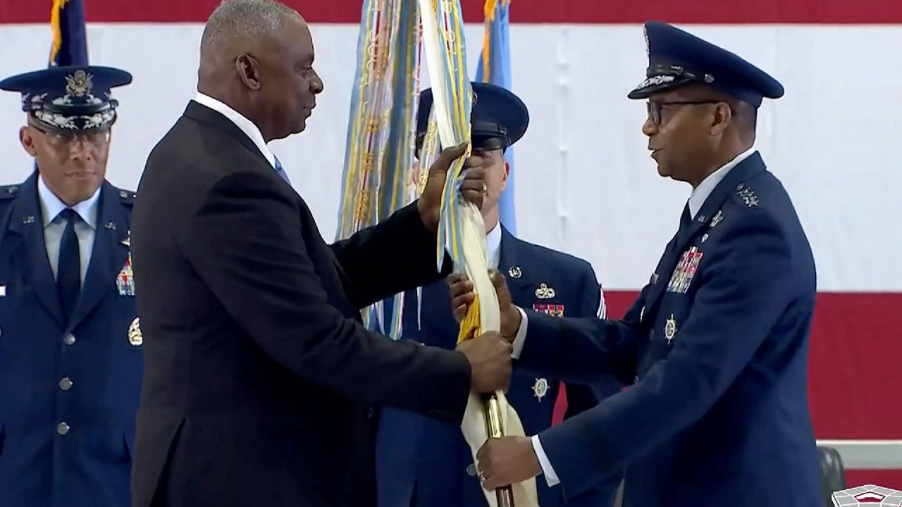 U.S. Defense Secretary Lloyd Austin III (left) presided over a ceremony Friday at Scott Air Force Base where Gen Randall Reed (right) assumed command of U.S. Transportation Command. (Courtesy: U.S. Department of Defense. 