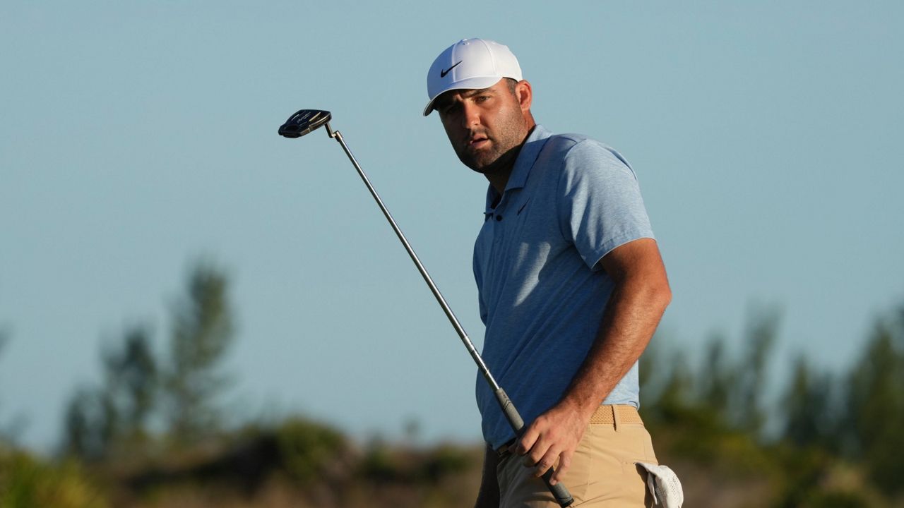 Scottie Scheffler, of the United States, watches his putt on the 17th green during the final round of the Hero World Challenge PGA Tour at the Albany Golf Club in New Providence, Bahamas, Sunday, Dec. 8, 2024. (AP Photo/Fernando Llano)