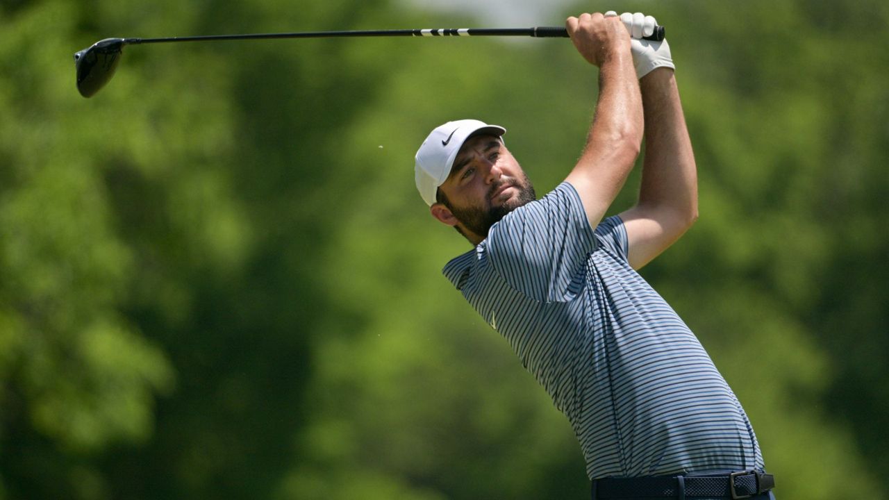 Scottie Scheffler watches his tee shot on the fifth hole during the final round of the PGA Championship golf tournament at the Valhalla Golf Club, Sunday, May 19, 2024, in Louisville, Ky. (AP Photo/Jon Cherry)