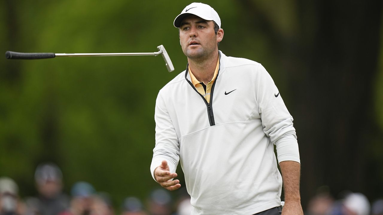 Scottie Scheffler flips his putter on the eighth hole during the third round of the PGA Championship golf tournament at Oak Hill Country Club on Saturday, May 20, 2023, in Pittsford, N.Y. (AP Photo/Eric Gay)