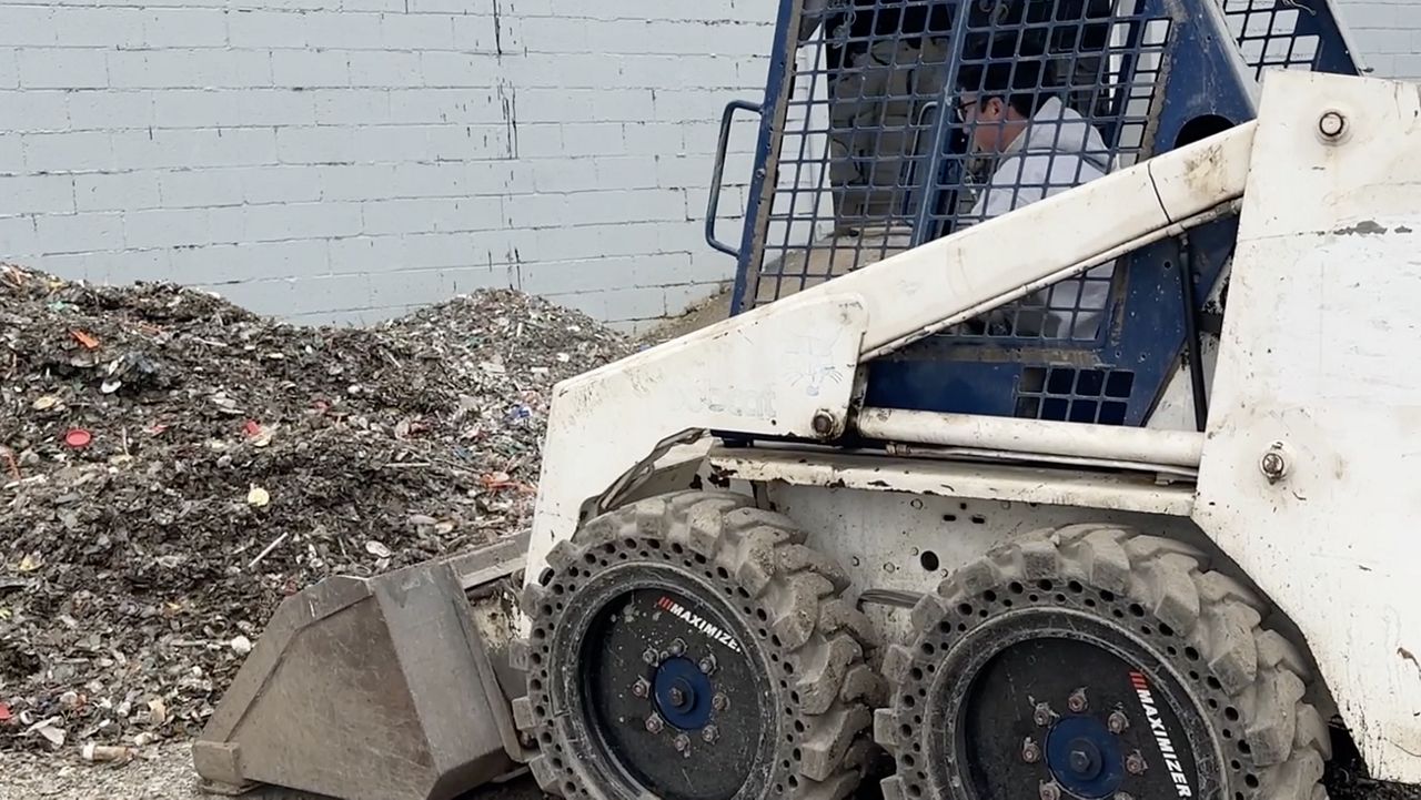 Machine picks up waste.