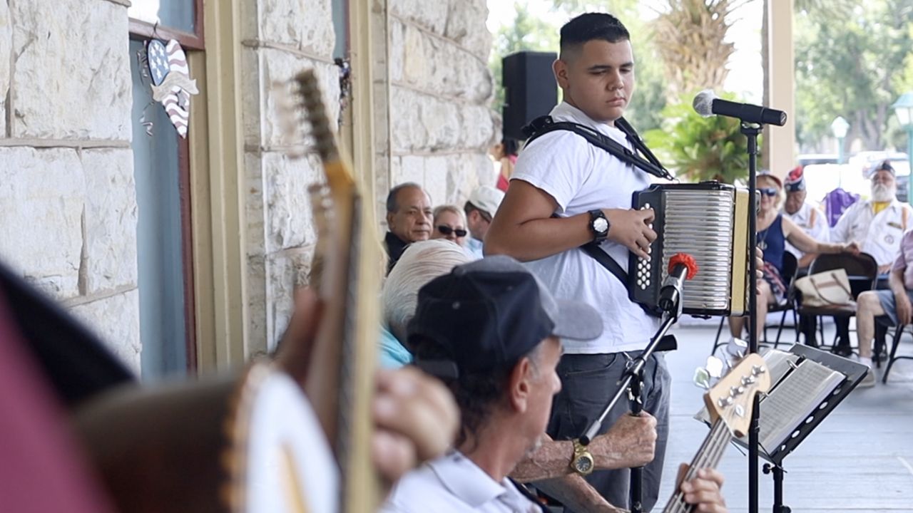 Anfernie performing with his group, Fern Y Su Conjunto. (Spectrum News 1/Jose Arredondo)