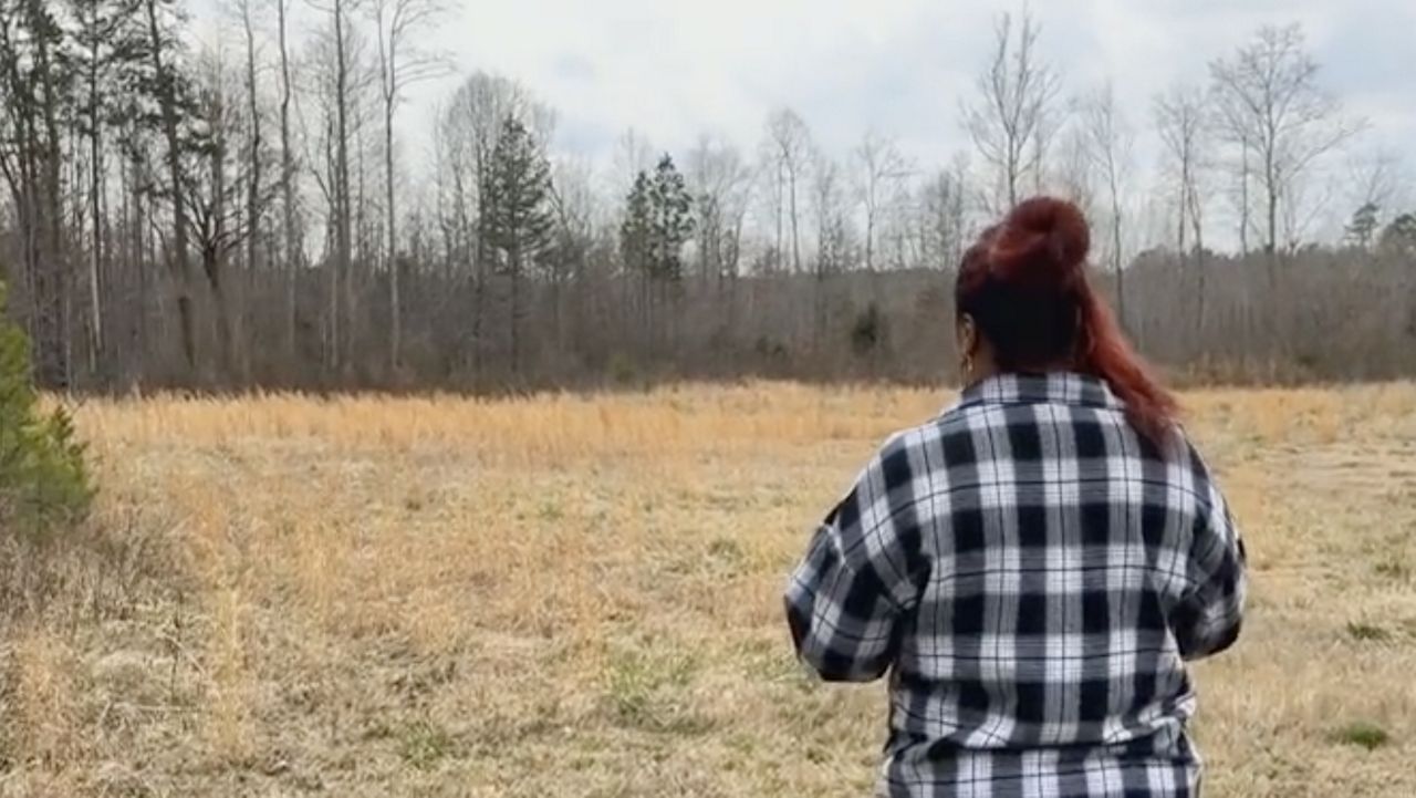 Mona Evans standing on the site of the tiny homes hoped to be added to the farm.