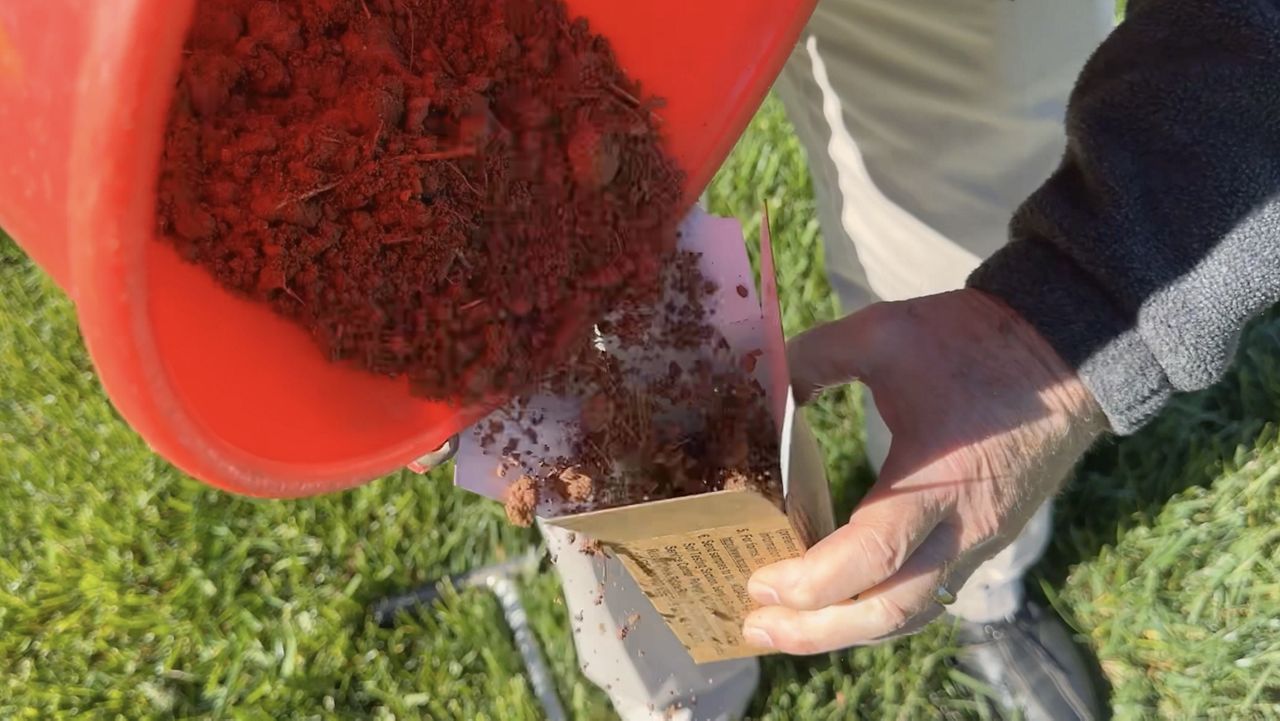 David Hardy collecting a soil sample.