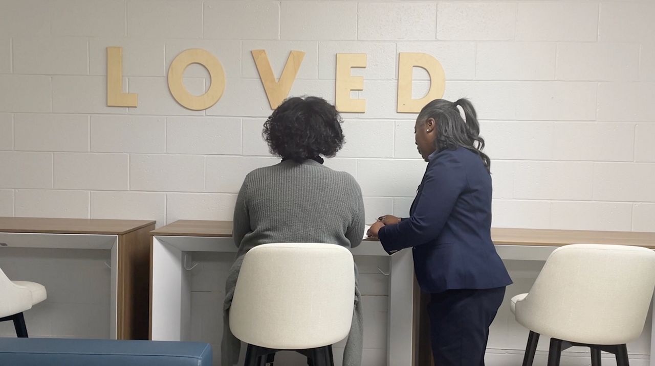 Toni Johnson, a Client Success Manager with the Raleigh Rescue Mission, is helping a client in their downtown Raleigh space. 
