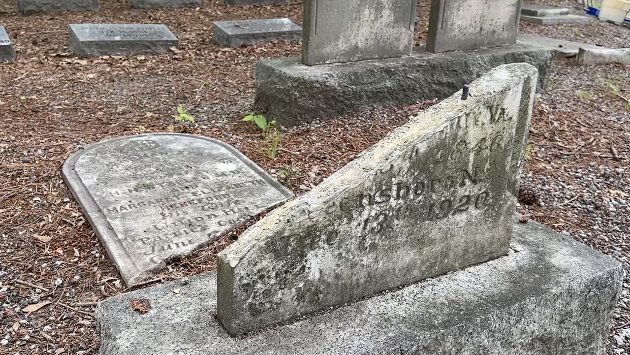 A broken gravestone at Green Hill Cemetery.