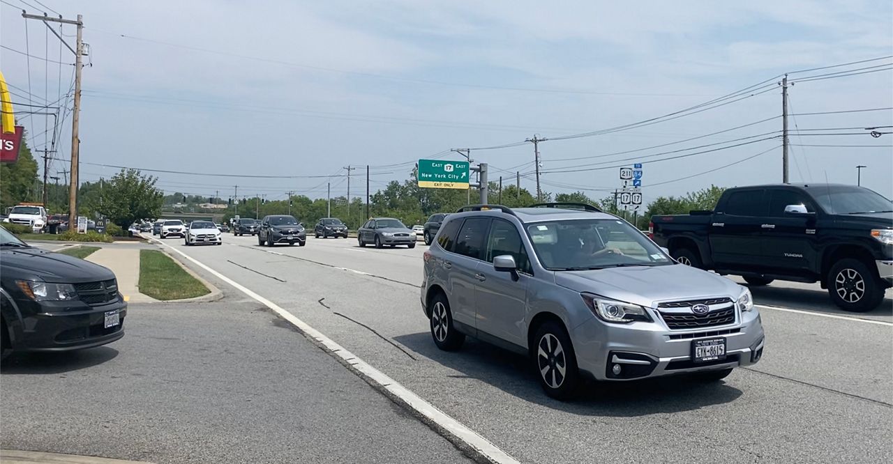 Cars drive down a stretch of Route 211 in Wallkill. 