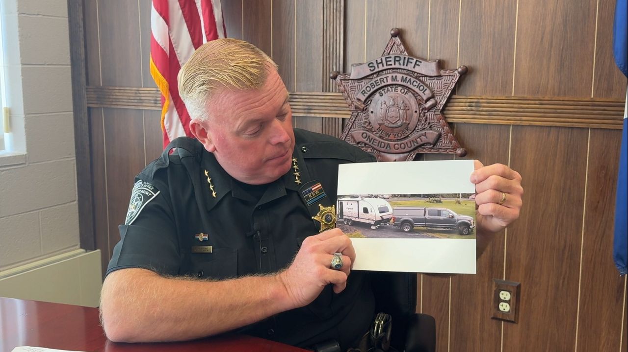 sheriff holding picture
