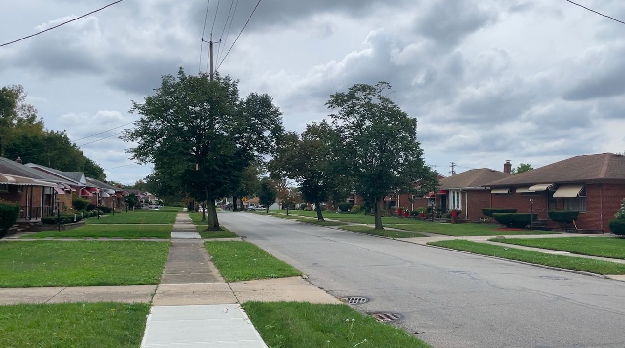 A residential street in the Lee-Harvard neighborhood with brick homes. 