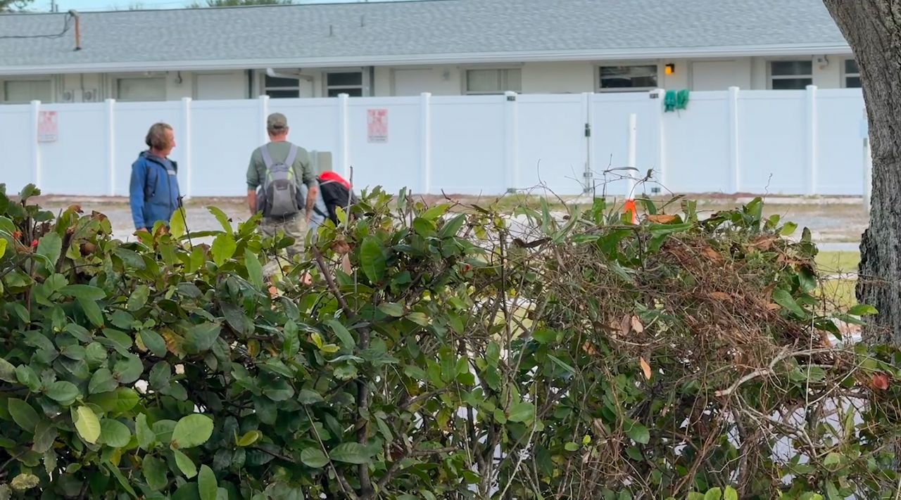 Homeless individuals walk along the streets of Fee Avenue near downtown Melbourne, which has led to complaints from neighborhood residents. (Spectrum News/Greg Pallone)