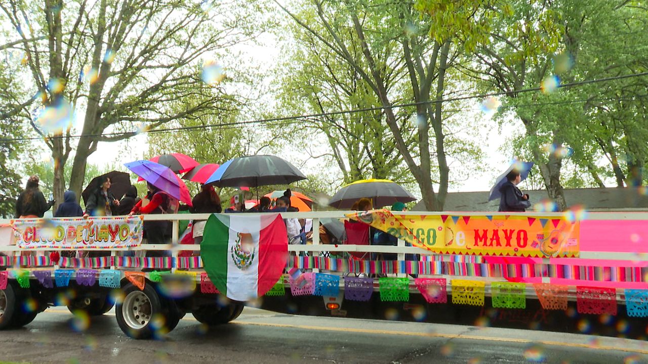 Dozens met outside of St. Frances Xavier Cabrini Roman Catholic Church before marching to Mexican Mutual Society to continue Cinco de Mayo celebrations. 