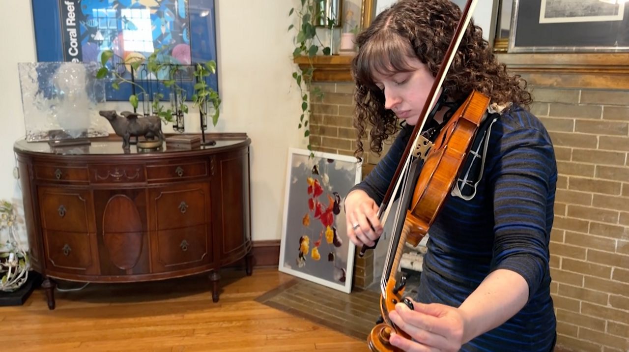 Daley Biddle said that as a professional violinist, she can't afford to have allergies affect her ears and her hearing.  (Spectrum News / Kimberly Perez)