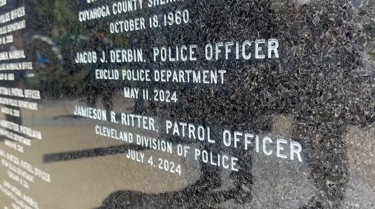 The names of two northeast Ohio police officers who were killed in the line of duty in 2024 were etched in the peace officers memorial in downtown Cleveland. (Spectrum News  / Kimberly Perez)