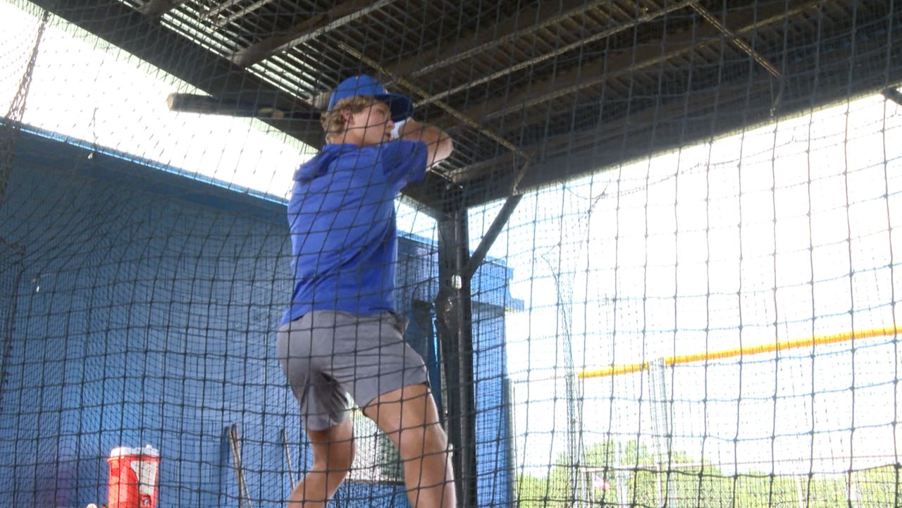 First Academy outfielder Remo Indomenico in the batting cage on campus. (Spectrum Sports 360)