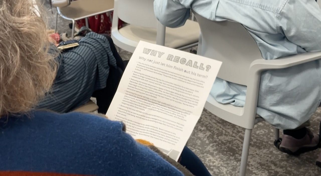 Cleveland Heights residents attend a meeting Tuesday evening to hear organizers speak about why they hope to recall the mayor. (Spectrum News / Kimberly Perez)