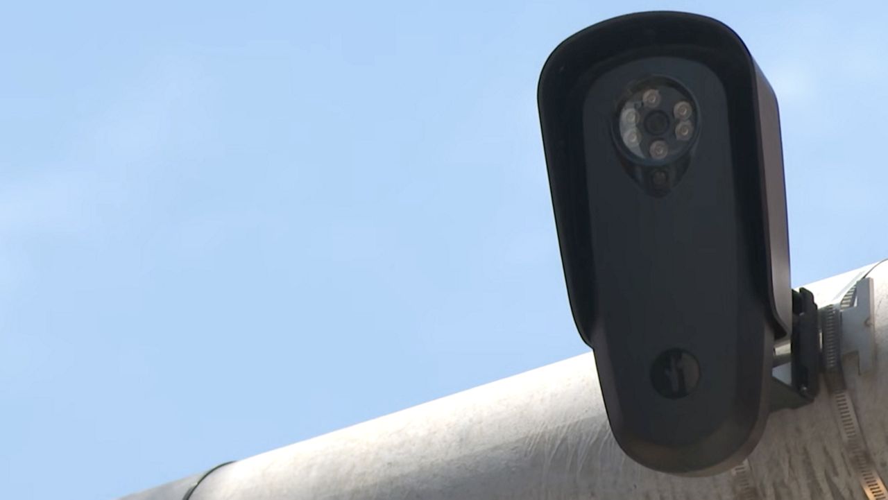 Flock camera on top of a street light (Spectrum News 1/Andres Rendon)