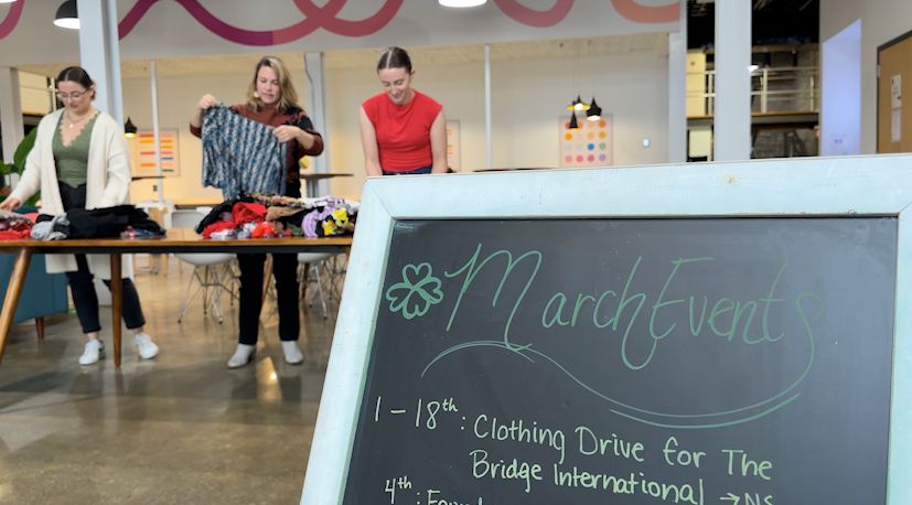 Jess Porta (middle) and others helping fold donated clothes for the clothing swap taking place the 'Runway to Resilience'. (Spectrum News 1/Sydney McCoy)