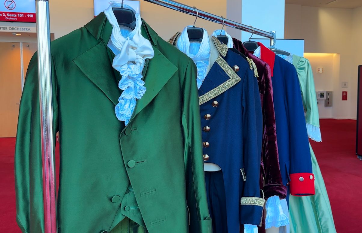 Wardrobe from Hamilton including Hamilton's green suit. (Spectrum News 1/ Sydney McCoy)