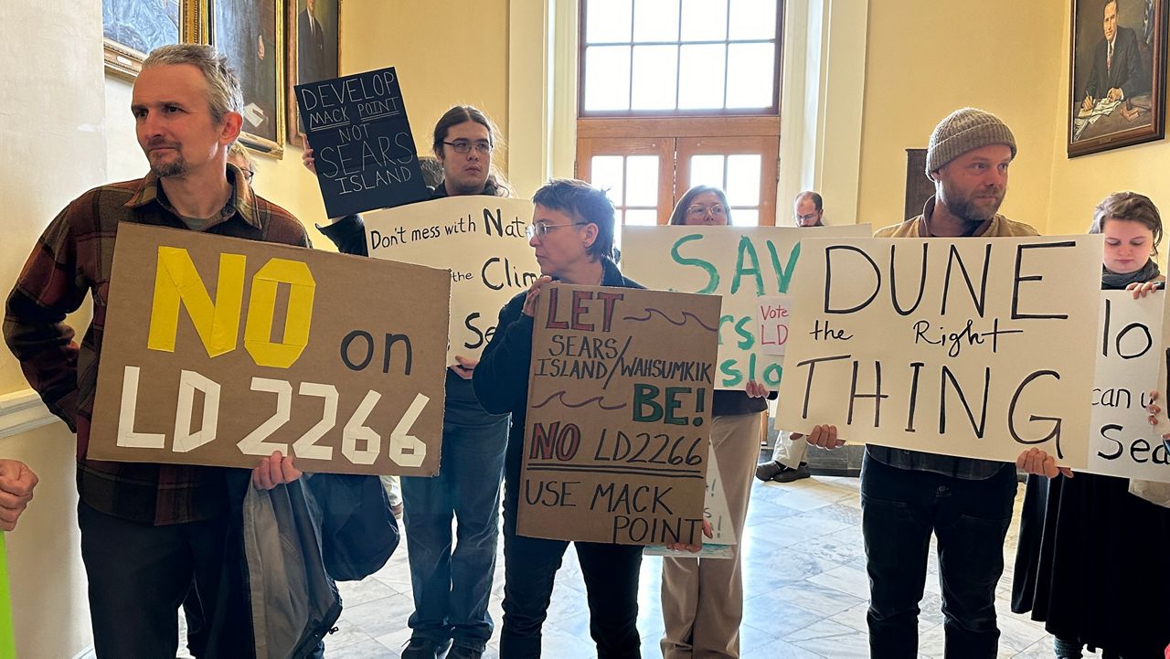 Protesters lined the State House halls Tuesday to urge lawmakers to reject a plan to put a wind port on Sears Island. (Spectrum News/Susan Cover)