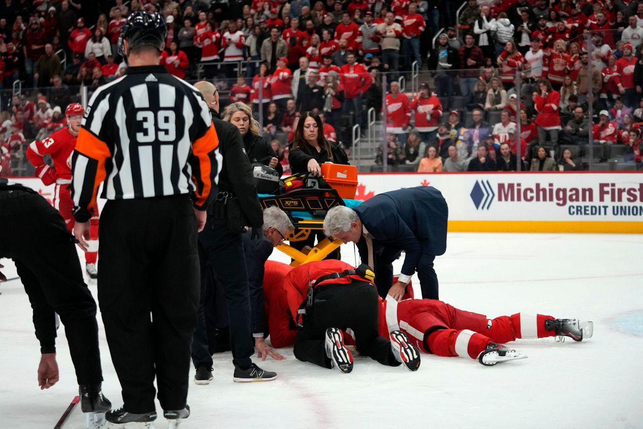 Red Wings' Larkin facedown, motionless on ice for about a minute after