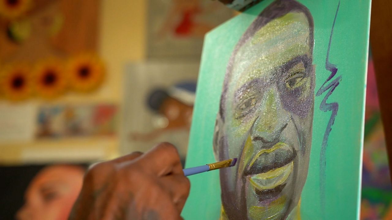 Local muralists create images that move people to action after George Floyd's death. (Spectrum News)