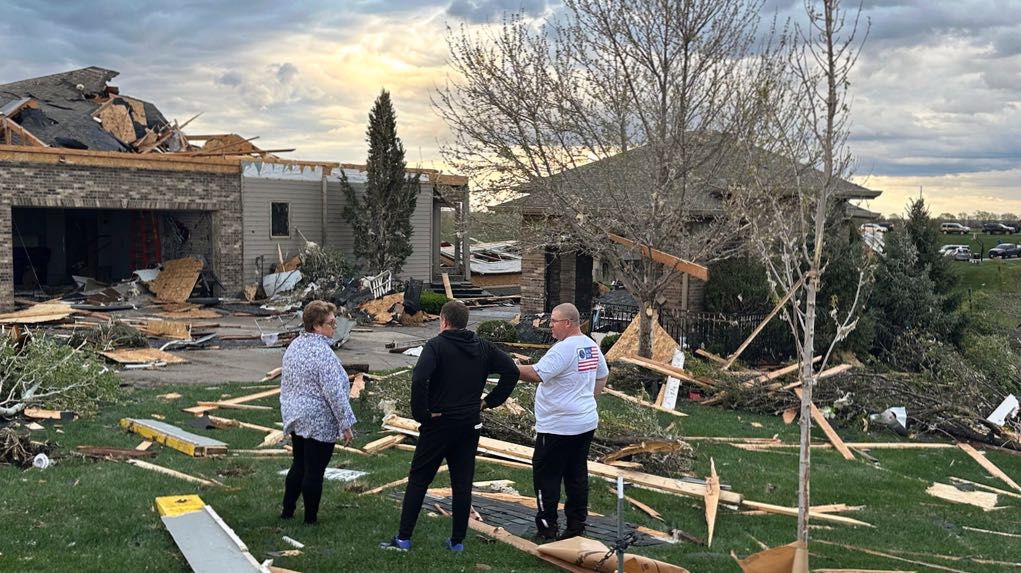 Homeowners assess damage after a tornado caused extensive damage in their neighborhood northwest of Omaha in Bennington, Neb., Friday, April 26, 2024. (AP Photo/Josh Funk)