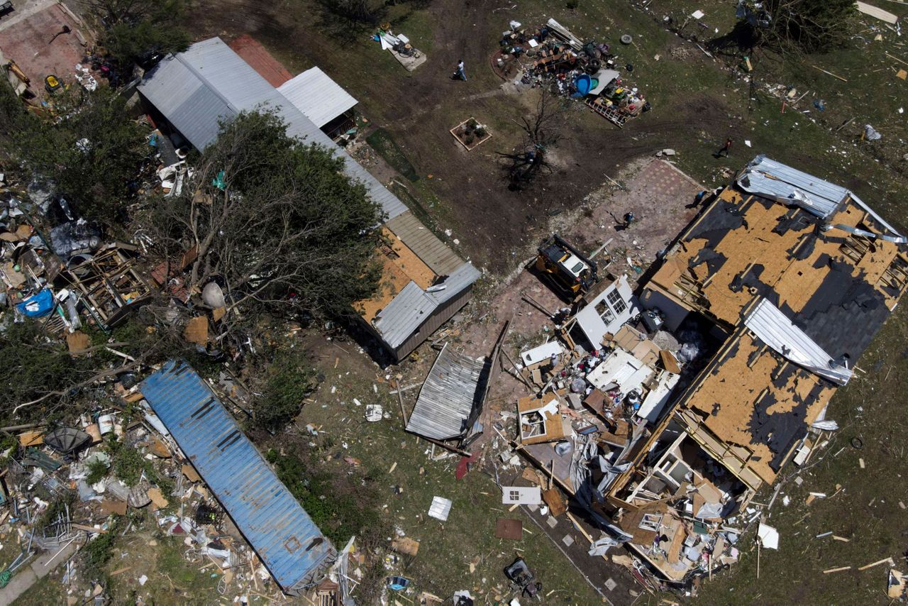 In a north Texas county, dazed residents sift through homes mangled by ...