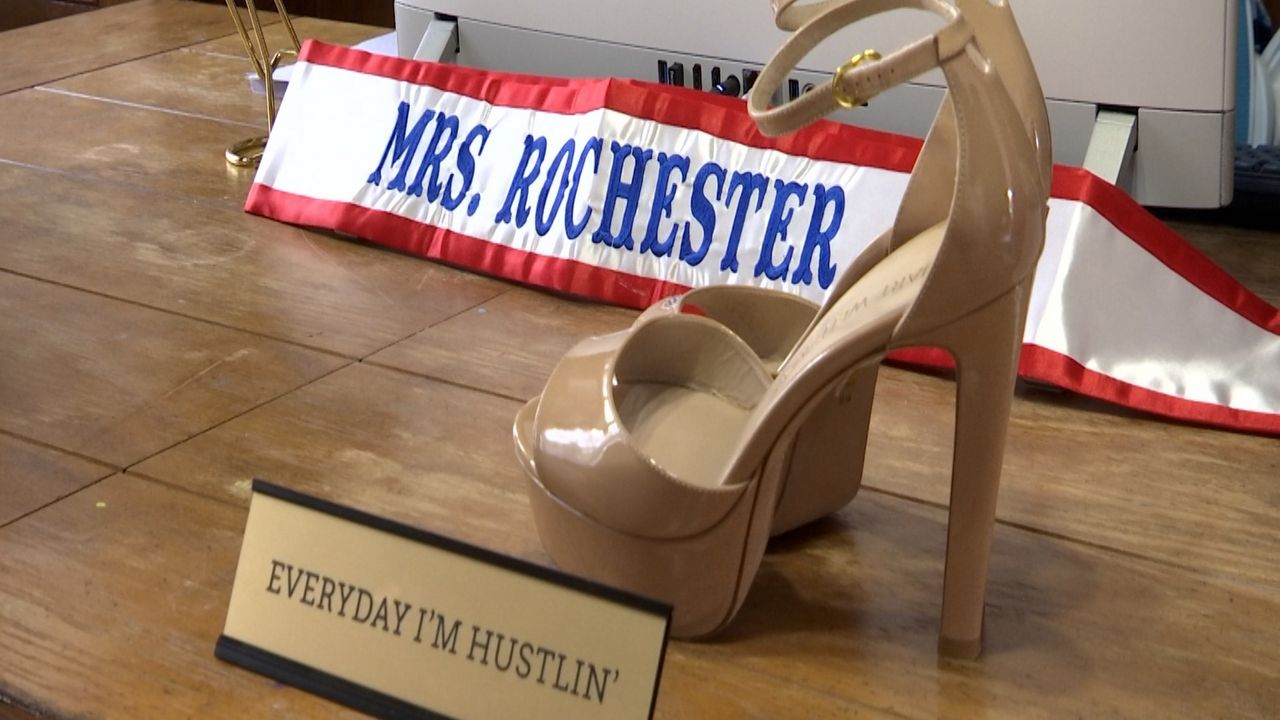 Shaina Zazarro's office with Mrs. Rochester sash and heels.