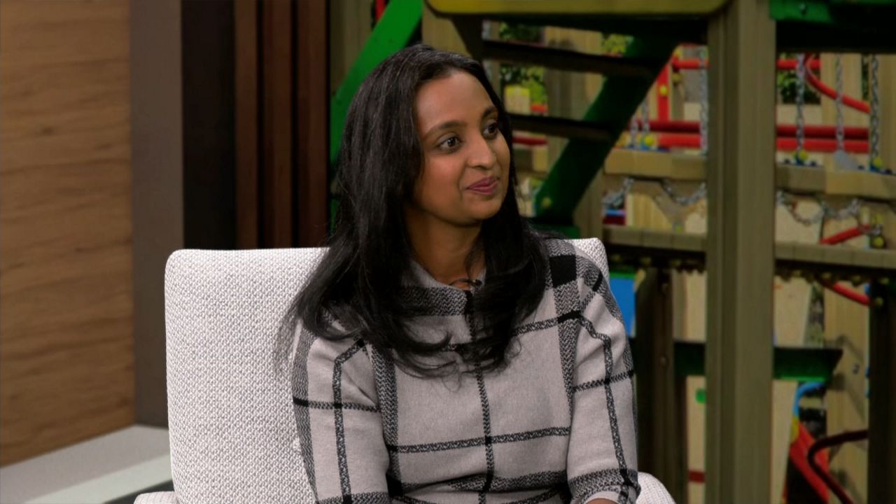 Sharmilla Fassbender listens as interviewer asks question