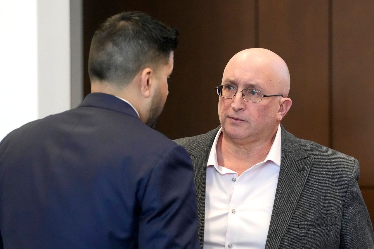 Father of July 4 parade shooting suspect pleads not guilty