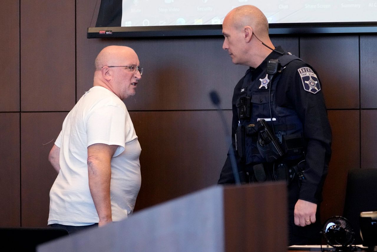 Father of July 4th parade shooting suspect turns himself in to begin ...