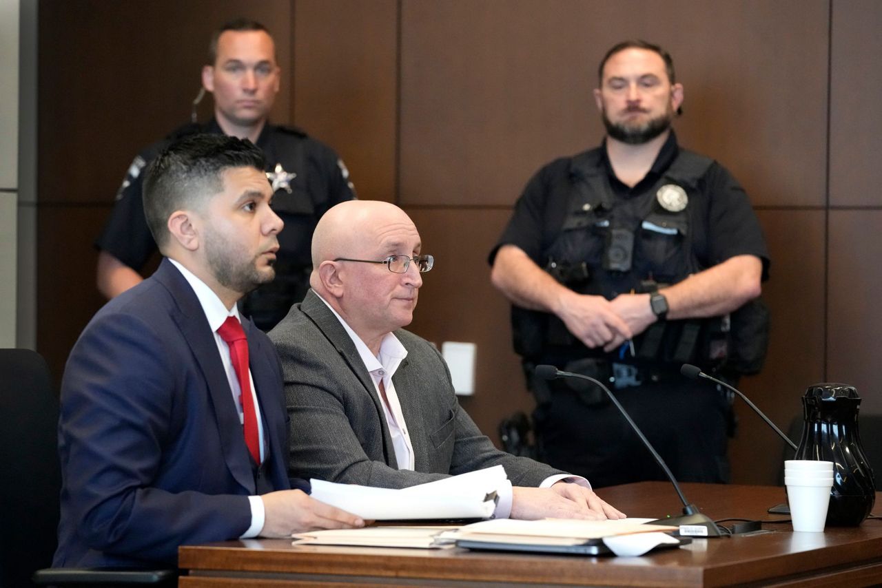 Father of July 4 parade shooting suspect pleads not guilty