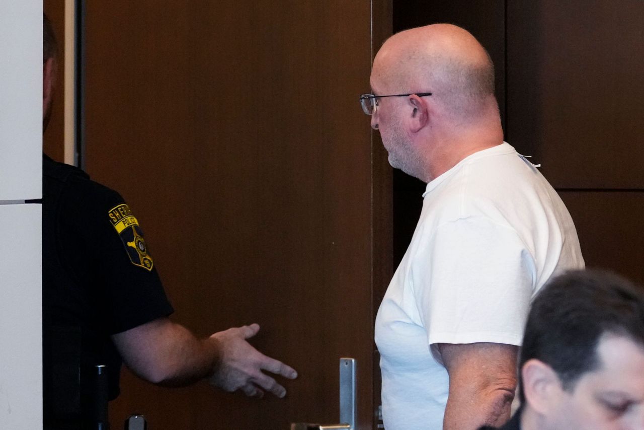 Father of July 4th parade shooting suspect turns himself in to begin ...
