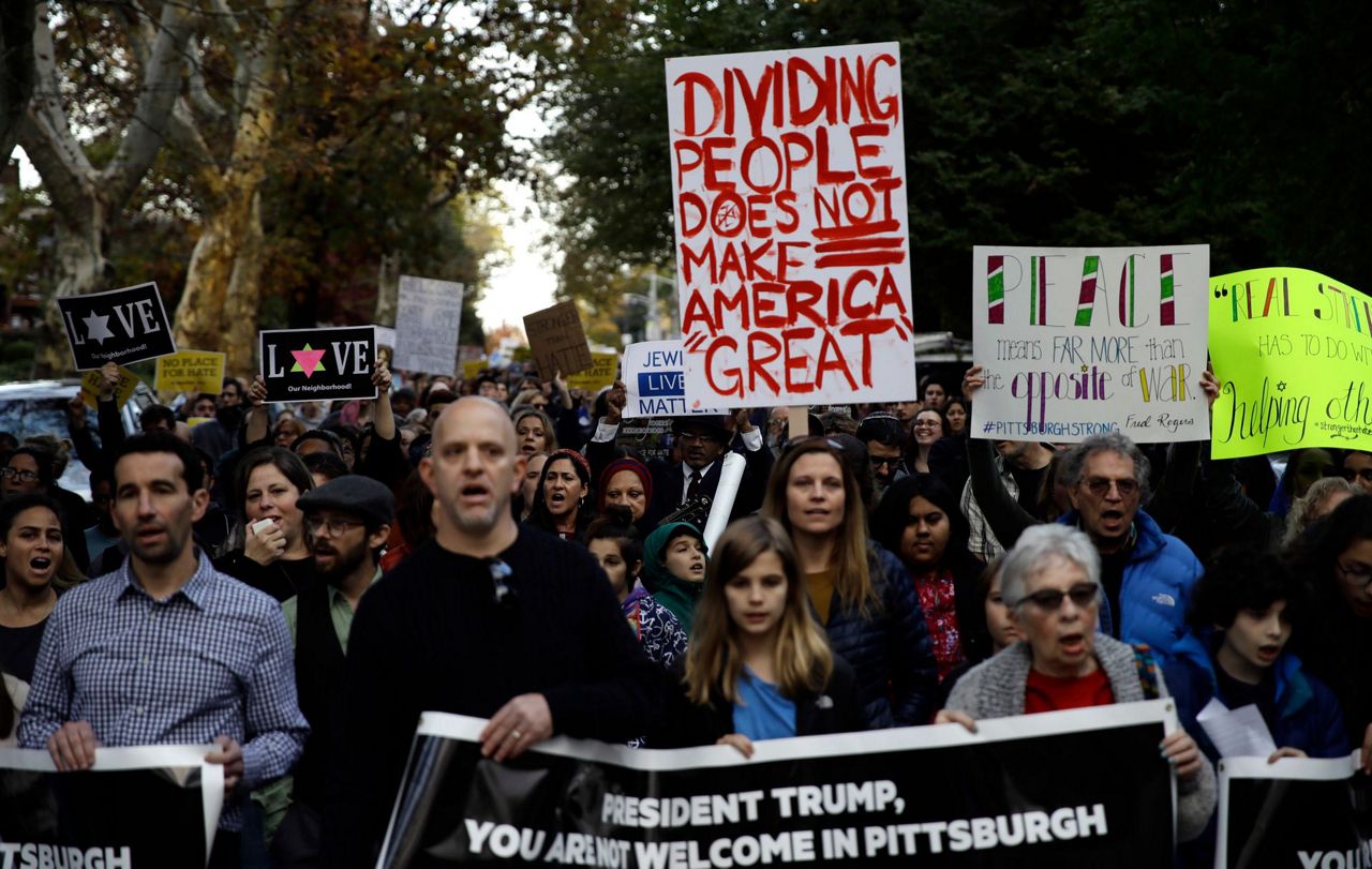 Mourning and protests as Pittsburgh begins victims' burials