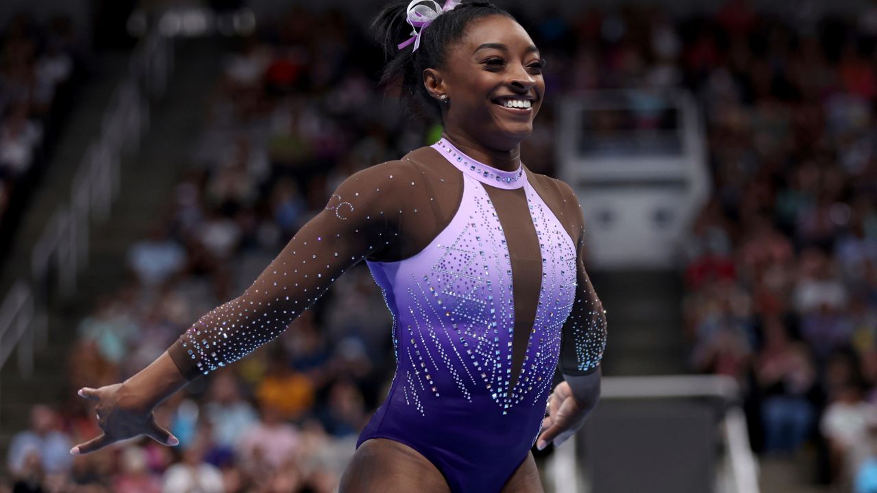 Simone Biles celebrates after competing in the floor exercise at the U.S. Gymnastics Championships, Friday, Aug. 25, 2023, in San Jose, Calif. (AP Photo/Jed Jacobsohn)