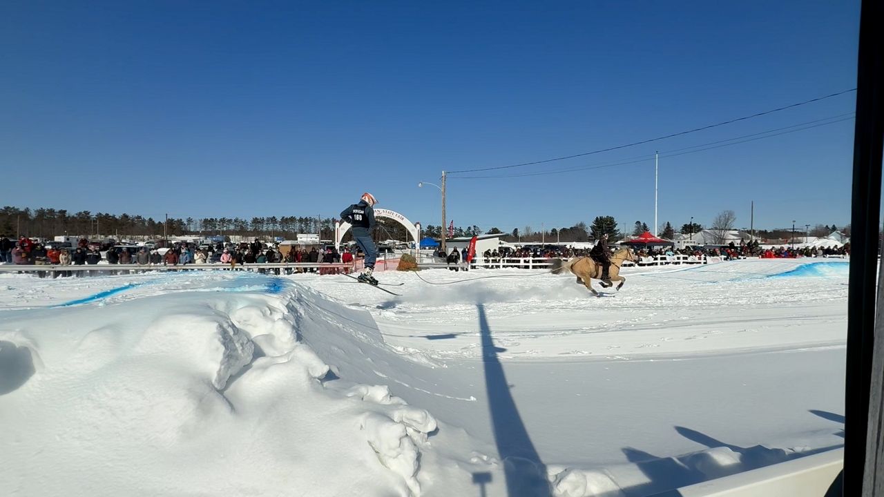 A skier jumps off a ramp at Skijor Skowhegan. (Spectrum News/David Ledford)
