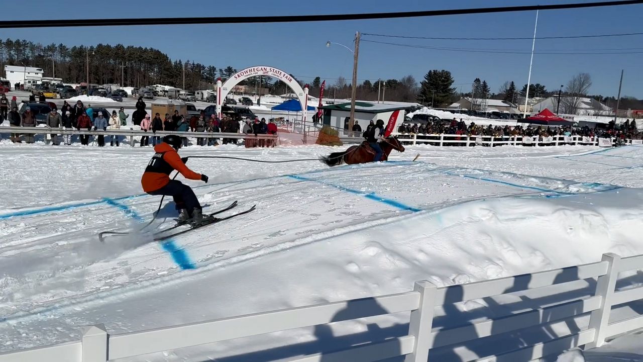 A skier prepares to make a jump at Skijor Skowhegan. (Spectrum News/David Ledford)