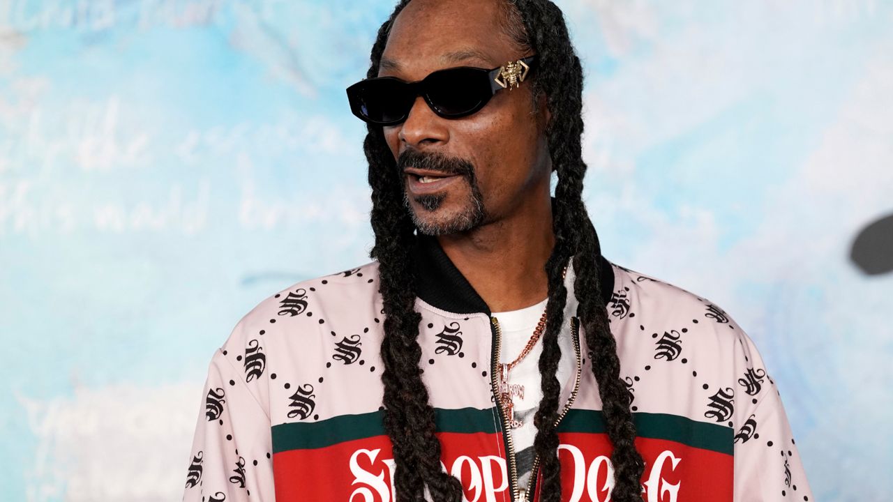 Snoop Dogg arrives at the premiere of the FX docuseries "Dear Mama," Tuesday, April 18, 2023, at The Ted Mann Theater in Los Angeles. (AP Photo/Chris Pizzello)