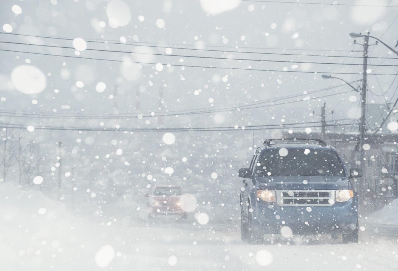 cars driving through snow