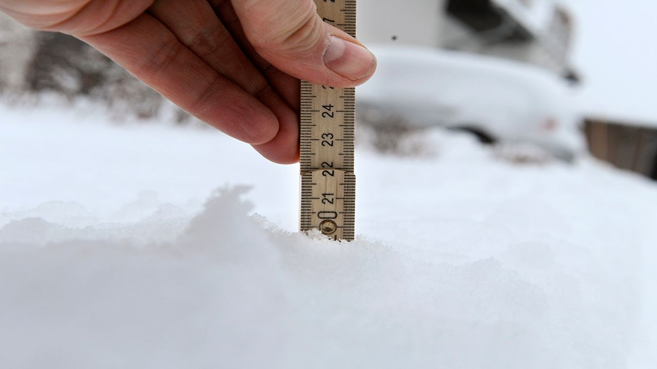 Heavy snow being measured