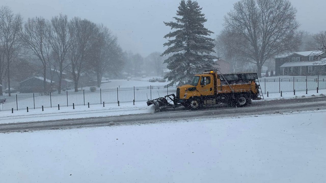 A St. Charles County snowplow clears the road in St. Charles on Feb. 16, 2024.