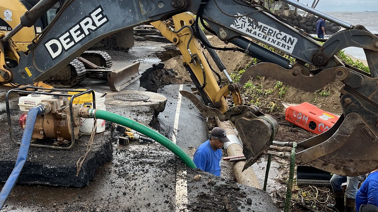 Maui County staff work to repair a water main break caused by flooding at the 500 block of South Kihei Road across from the Isana restaurant. (Photo courtesy of Maui County)