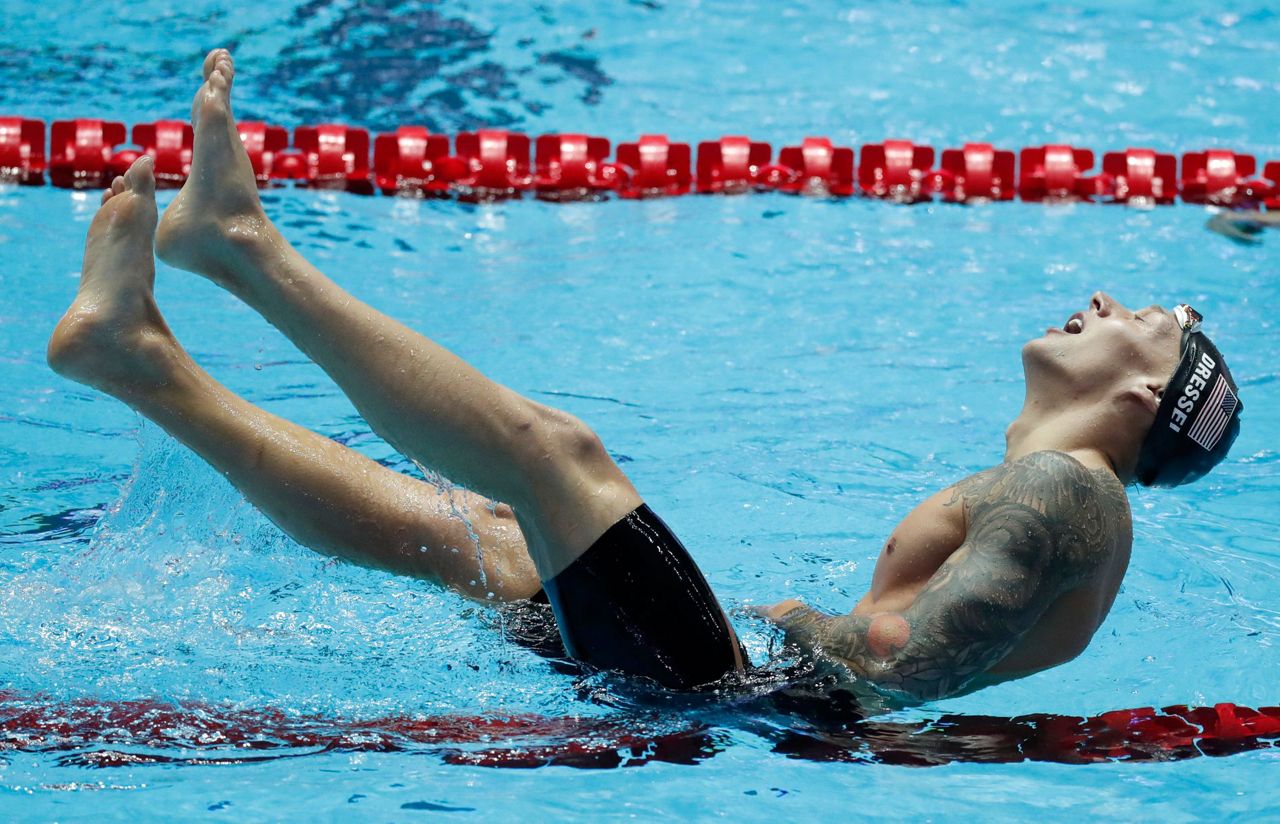 Caeleb Dressel retains title in 100 free at world swims