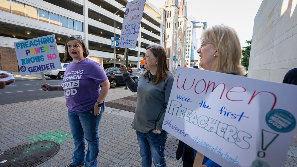 Nikki Hardeman, Atlanta, Georgia, director of legislating for Baptist Women in Ministry, from left; Meredith Stone, executive director of Baptist Women in Ministry, and Christa Brown, an advocate for the Baptist Women in Ministry, stand outside the venue of a Southern Baptist Convention annual meeting Tuesday, June 11, 2024, in Indianapolis. (AP Photo/Doug McSchooler)