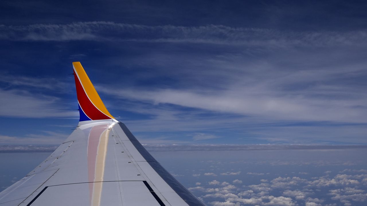 A Southwest Airlines Boeing 737 Max 8 passenger jet flies over the central United States heading for Chicago from Tulsa, Okla., June 15, 2024, in Tulsa.