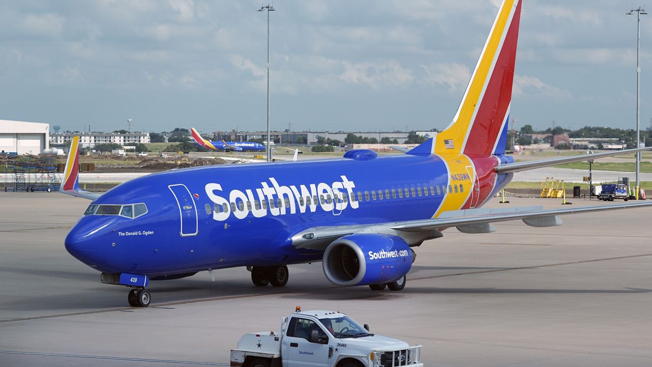 A Southwest Airlines plane moves to departs from Love Field in Dallas, Thursday, July 25, 2024. (AP Photo/LM Otero)