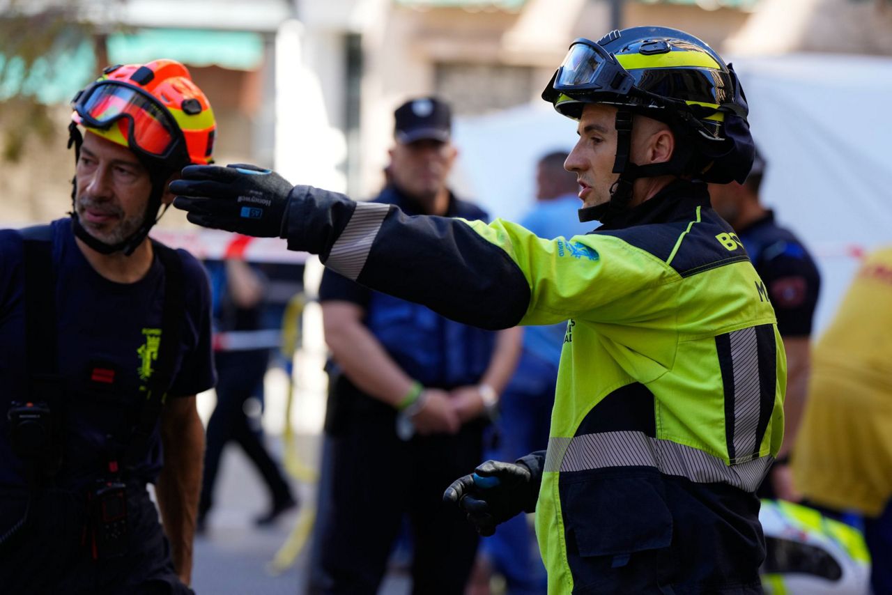 Spanish firefighters respond to building collapse in Madrid